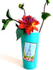 Turquoise vase with Paris landmark postcards