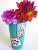 Turquoise vase with Paris landmark postcards