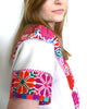 Pink red and white cross-stitched blouses Mexico