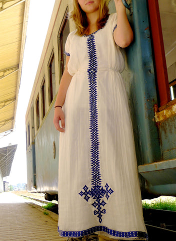 White traditional Ethiopian dress with blue cross embroidered motif
