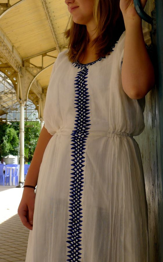 White traditional Ethiopian dress with blue cross embroidered motif FTWWL White traditional Ethiopian dress with blue cross embroidered motif FTWWL