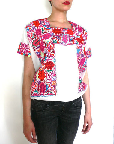 Pink red and white cross-stitched blouses Mexico