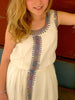 White, sleeveless traditional Ethiopian dress with multicolored cross embroidered motif