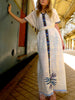 White traditional Ethiopian dress with multicolored embroidery