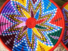 Pink,red  green and blue handwoven basket from Labilela