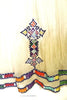 White, sleeveless traditional Ethiopian dress with multicolored cross embroidered motif