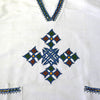 White traditional Ethiopian tunic with multicolored cross embroidered motif